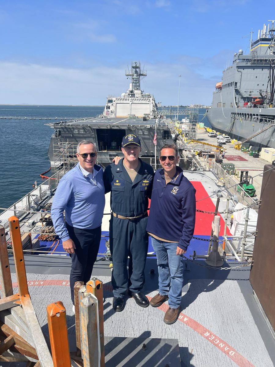 Philip Ariganello, Theodore LeClair, and Dana with a Navy commanding officer aboard ship